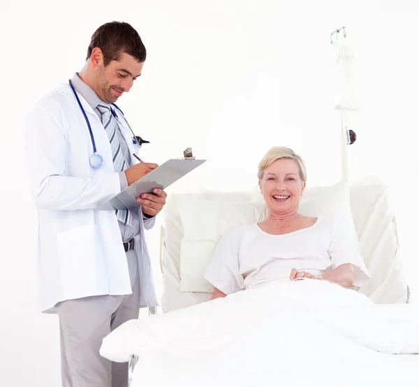 Female patient with handsome doctor — Stock Photo, Image