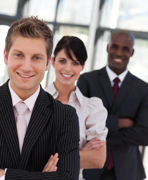 Cheerful business team looking at the camera — Stock Photo, Image