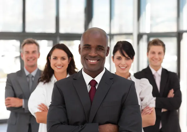 Smiling confident business team looking at the camera — Stock Photo, Image