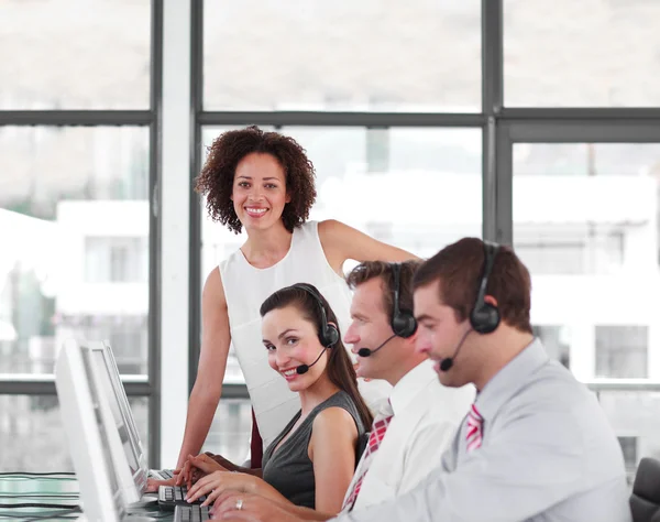 Serious female manager with her sale representative team — Stock Photo, Image