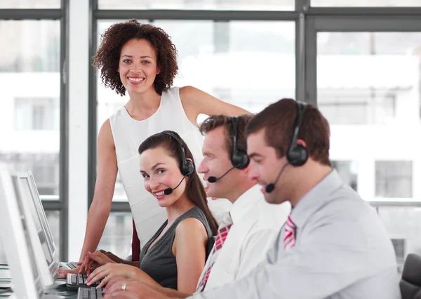 Self-assured female manager with her sale representative team — Stock Photo, Image