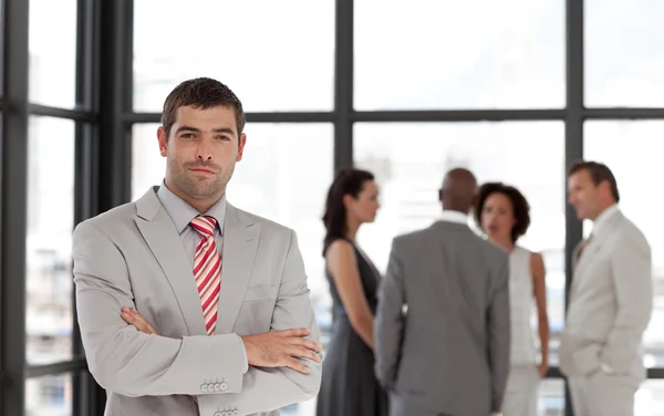 Attractive confident male manager leading his team — Stock Photo, Image