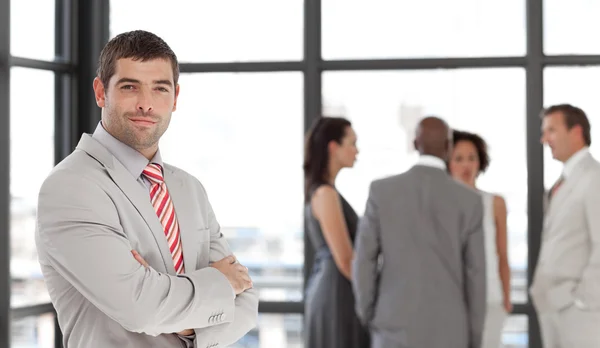 Latin confident male manager leading his team — Stock Photo, Image