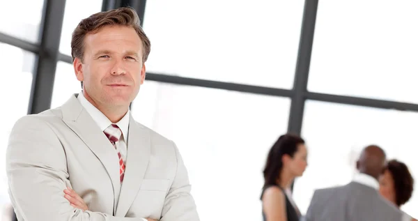 Caucasian male manager leading his team — Stock Photo, Image