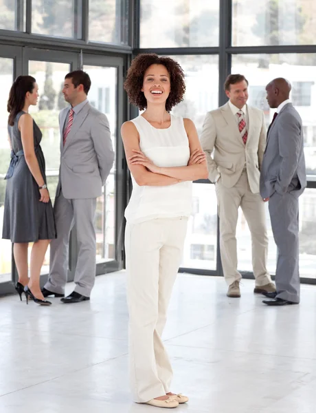 Cute Businesswoman arms folded with his colleagues — Stock Photo, Image