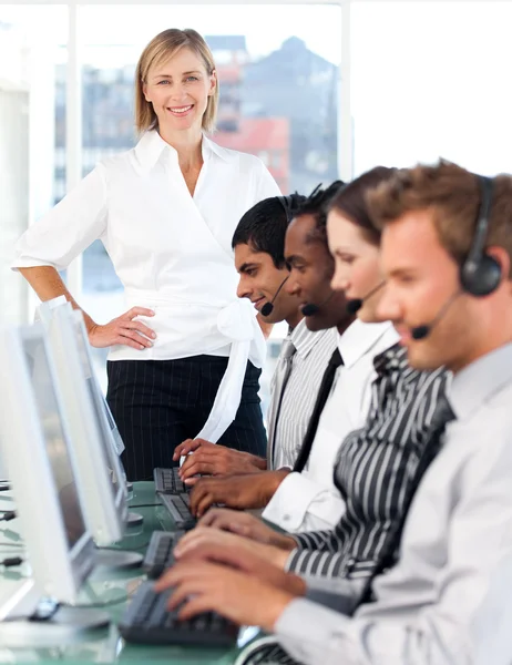 Smiling female manager leading her representative team — Stock Photo, Image