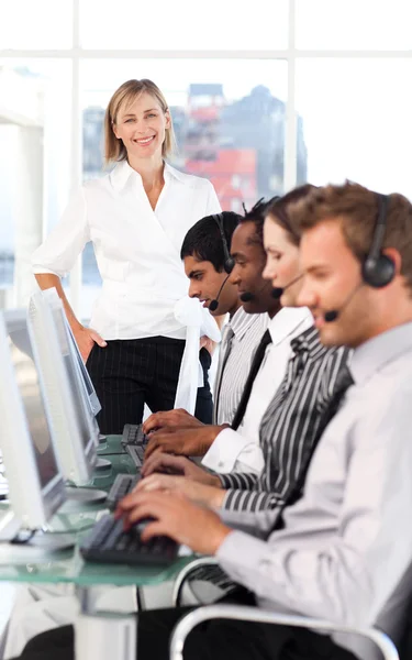 Cheerful female manager leading her representative team — Stock Photo, Image