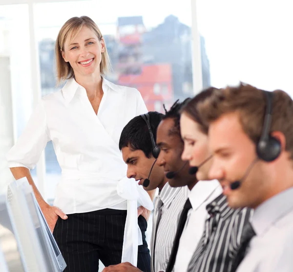 Serious female manager leading her representative team — Stock Photo, Image