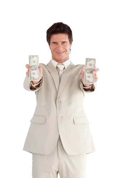 Empresario alegre sosteniendo dólares — Foto de Stock