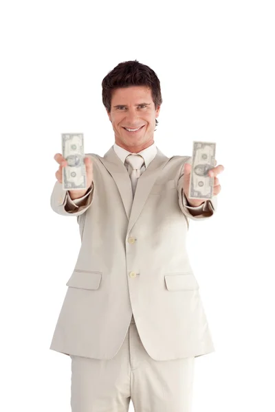 Hombre de negocios guapo sosteniendo dólares — Foto de Stock