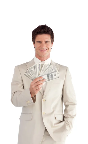 Зрелый бизнесмен, держащий доллары — стоковое фото