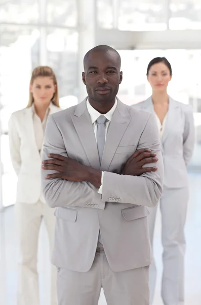 Serious afro-american manager with his team — Stock Photo, Image