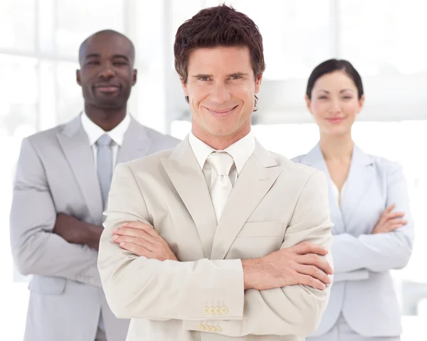 Serious attractive manager with his team — Stock Photo, Image