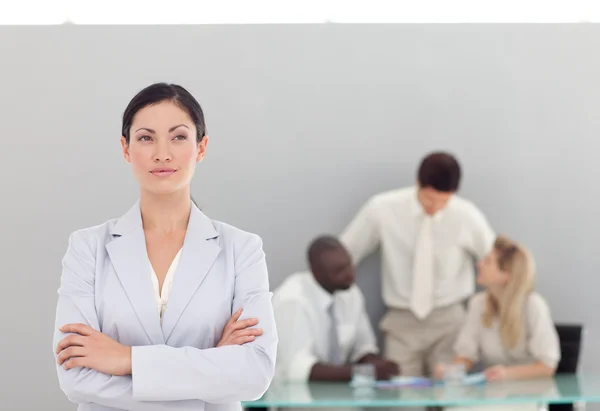 Serious female manager with her team — Stock Photo, Image