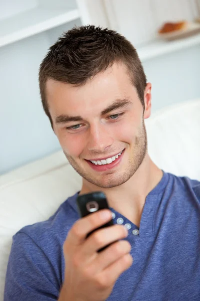 Attractive man writing a message — Stock Photo, Image