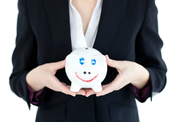 Close-up of a businesswoman holding a piggybank — Stock Photo, Image