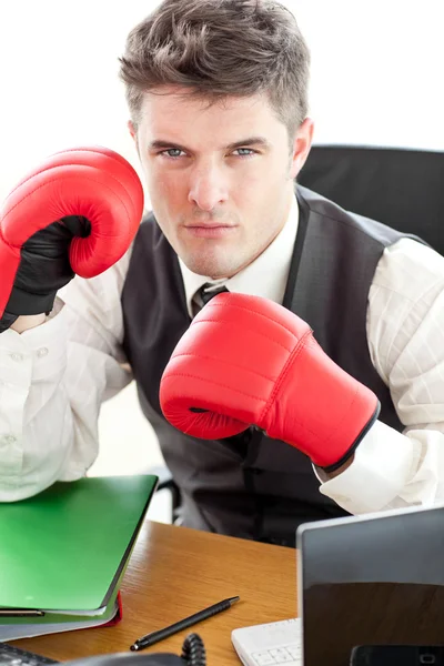 Angry businessman wearing boxing gloves — Stock Photo, Image