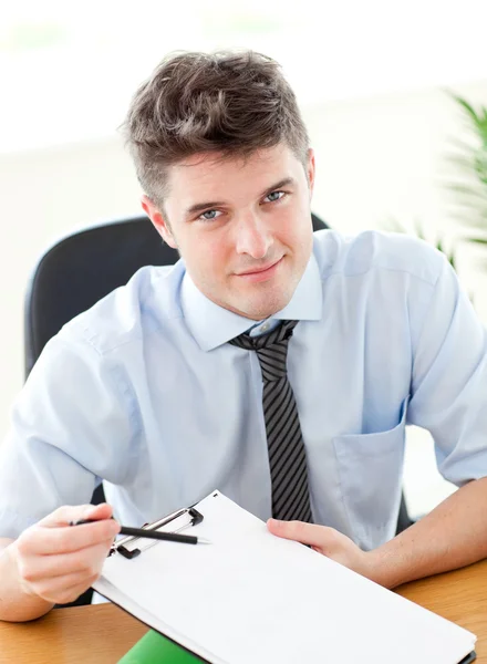 Smiling businessman showing a contract to a customer — Stock Photo, Image
