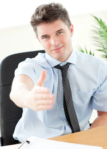 Charismatic businessman holding out his hand — Stock Photo, Image