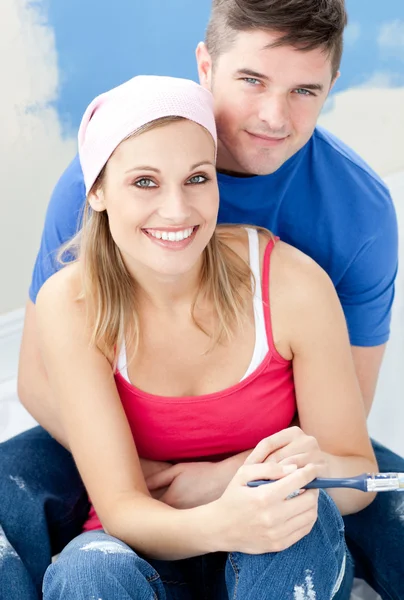 Portrait of a loving couple after painting a room — Stock Photo, Image
