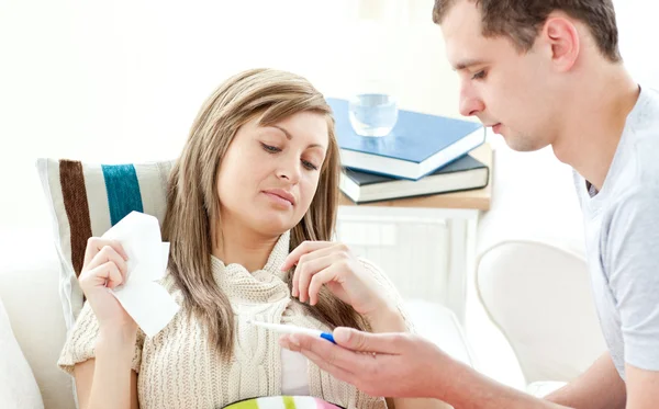 Beautiful sick woman getting pills from her boyfriend — Stock Photo, Image