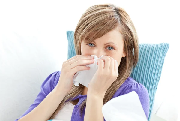 Portrait of a sick pretty woman blowing — Stock Photo, Image
