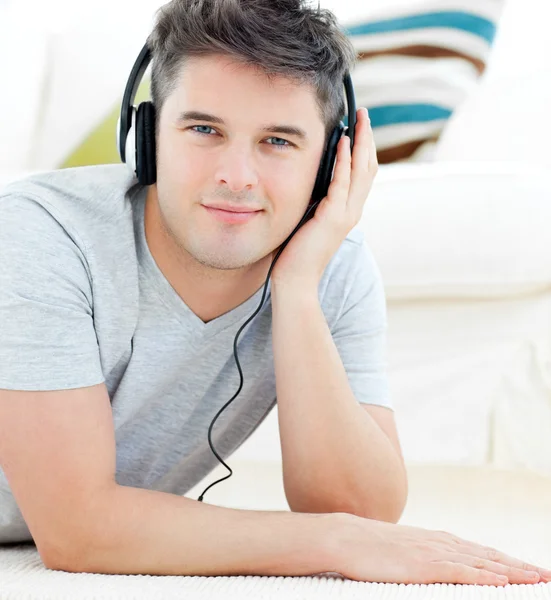Portrait of a happy man with headphones looking at the camera — Stock Photo, Image