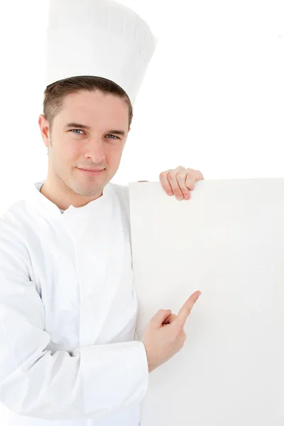 Αυτοπεποίθηση νεαρός μάγειρας δείχνει σε λευκό χαρτί — Φωτογραφία Αρχείου