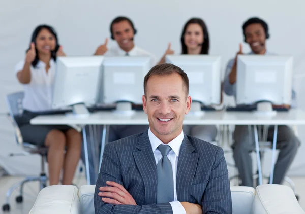 Manager in call center with his team with thumbs up — Stock Photo, Image