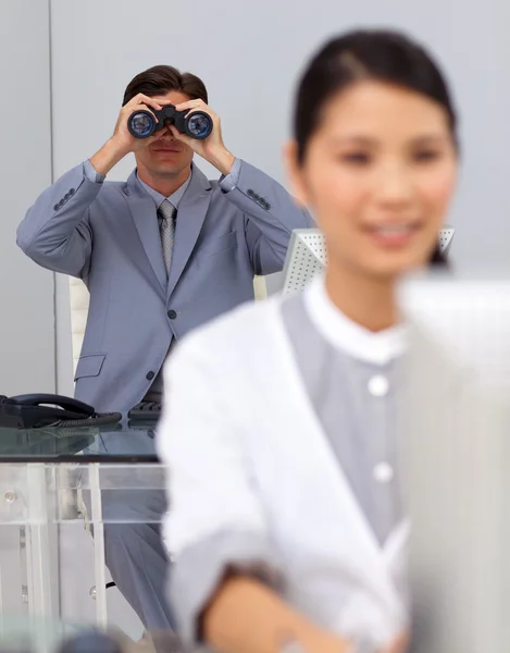 Visionary businessman using binoculars — Stock Photo, Image