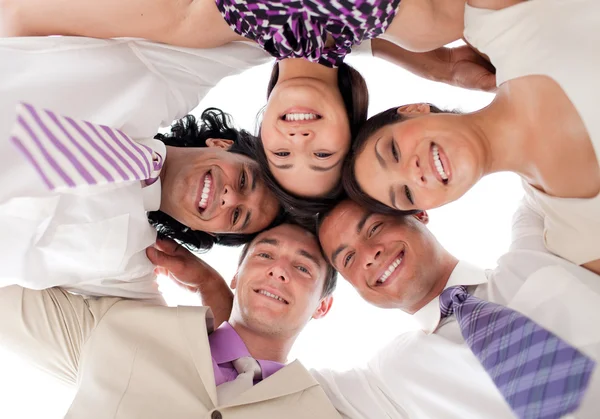 stock image Smiling business team in a circle with heads together