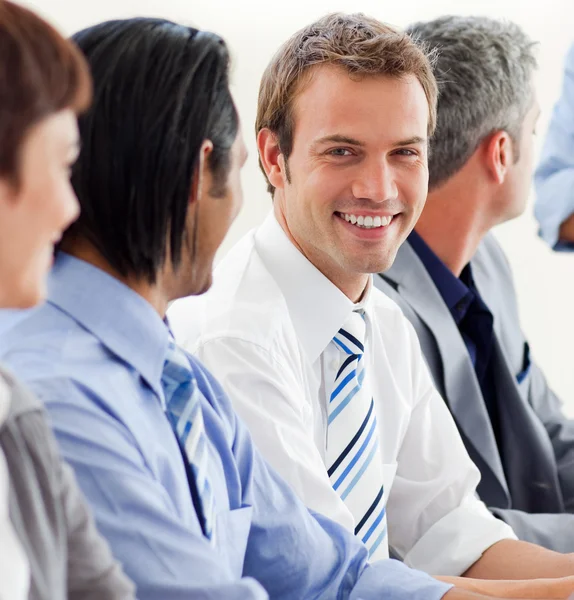 Delighted businessman looking at the camera in a meeting — Stock Photo, Image