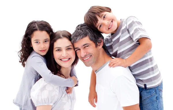 Smiling parents giving their children a piggyback ride — Stock Photo, Image