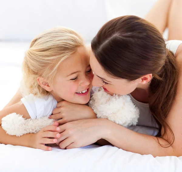 Attentive mother hugging her daughter — Stock Photo, Image