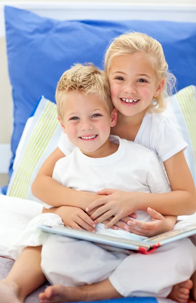 Blond brother and daughter reading books — Stock Photo, Image
