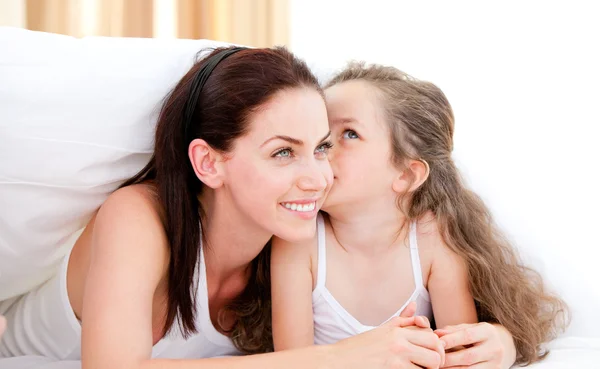 Adorable little girl kissing her mother — Stock Photo, Image