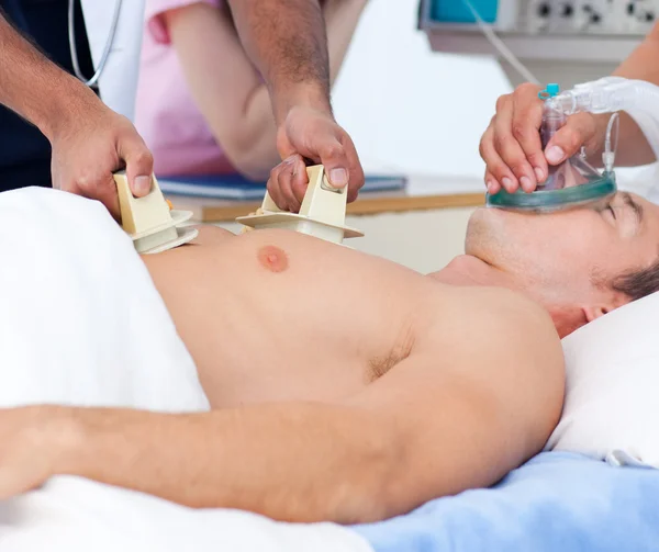 Close-up of a medical team resuscitating a patient — Stock Photo, Image