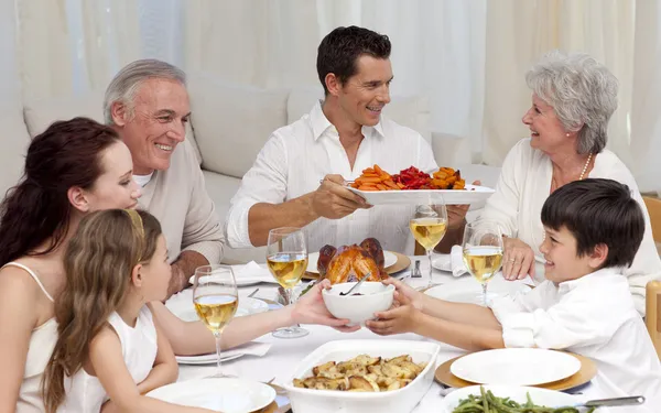 Family having a big dinner at home — Stock Photo, Image