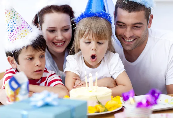 Little girl blowing out candles in her birthday — Stock Photo, Image