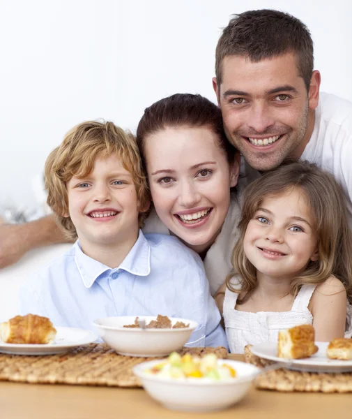 Portrait of happy family having breakfast — Stock Photo, Image