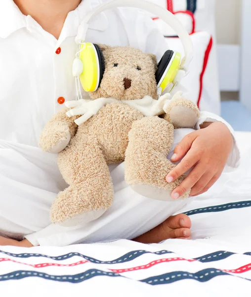 Close-up of a teddy bear with headphones on — Stock Photo, Image