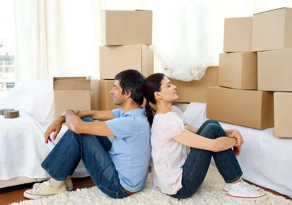 Tired couple relaxing while moving house — Stock Photo, Image