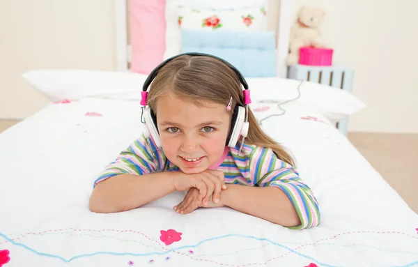 Cute little gril listening to music — Stock Photo, Image