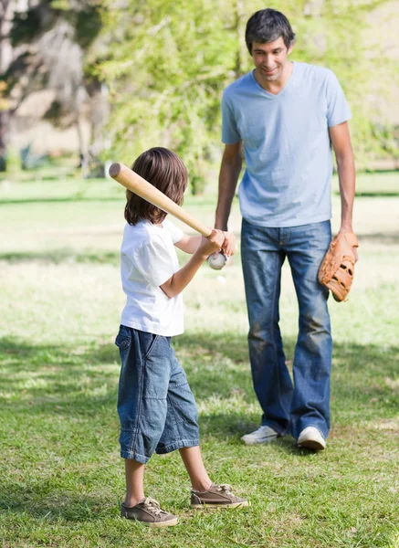 Cute little boy playing baseball with his father — Stock Photo, Image