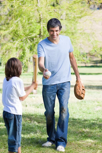Adorable little boy playing baseball with his father — Stock Photo, Image