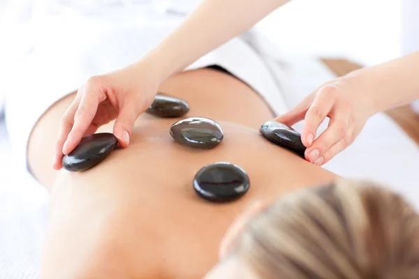Relaxed woman having a stone therapy — Stock Photo, Image