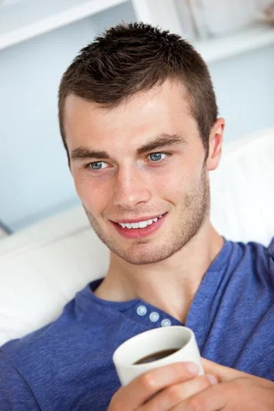 Attractive man drinking a coffee — Stock Photo, Image