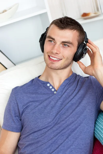 Good-looking man listening to music — Stock Photo, Image