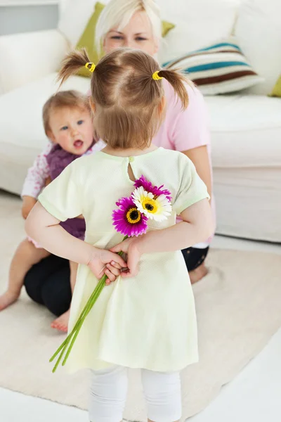 Sweet woman get surprise by her daughters — Stock Photo, Image