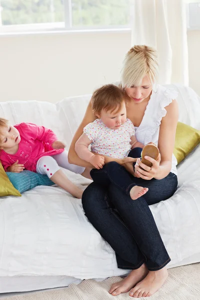 Pretty mother playing with her daughters — Stock Photo, Image